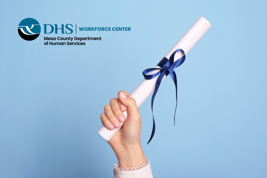 Hand holding up a diploma with the Workforce Center logo